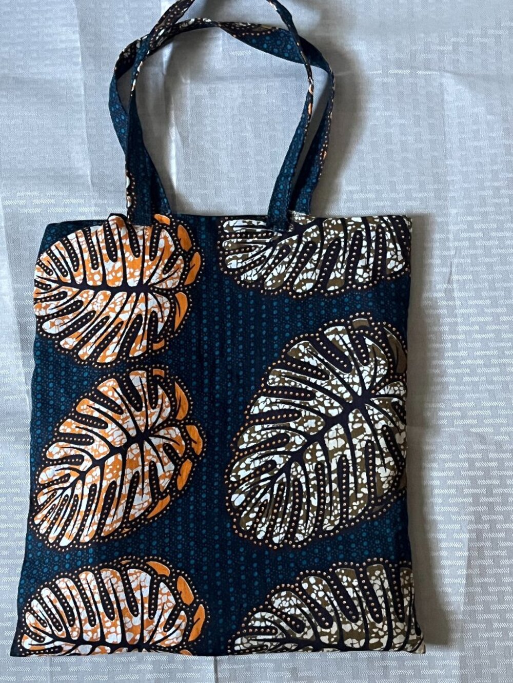 Stylish Blue Tote Bag with beautiful lorange leaf pattern really solid.